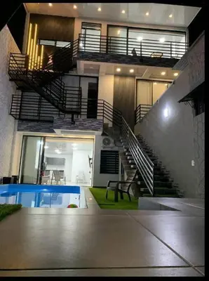 a view of a building with stairs and a pool at Apartamento de descanso in La Dorada