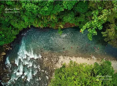 an aerial view of a beach and water with trees at Hotel Bruselas Mutata in Mutatá