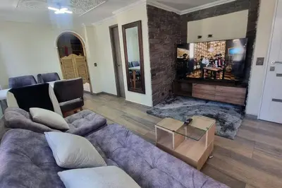 a living room with a couch and a fireplace at apto a 3 cuadras del estadio espectacular in Medellín