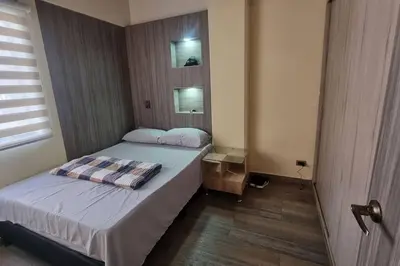 a small bedroom with a bed and a window at apto a 3 cuadras del estadio espectacular in Medellín