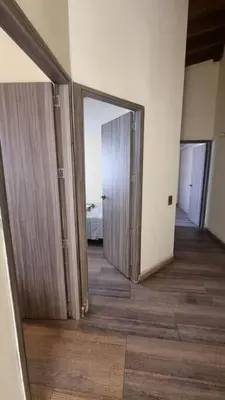 a hallway with two sliding doors in a room at apto a 3 cuadras del estadio espectacular in Medellín