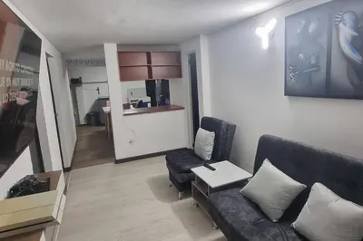 a living room with a couch and a table at hermosa casa para tour comuna 13 in Medellín