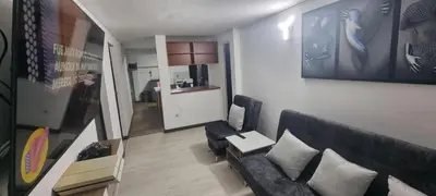 a living room with a couch and a table at hermosa casa para tour comuna 13 in Medellín