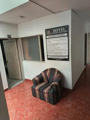 a chair sitting in a room in a building at Hotel Confort Boutique in Rionegro