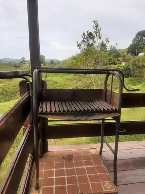 a bench on a balcony with a view of a field at Hoguera del Nómada in Santo Domingo
