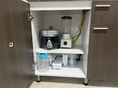 a kitchen cabinet with a blender on a shelf at Apartamento Dcastańo in Medellín