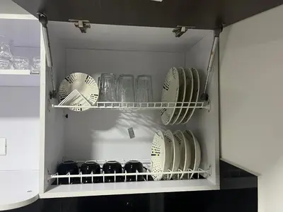 a cabinet filled with plates and bowls and dishes at Apartamento Dcastańo in Medellín