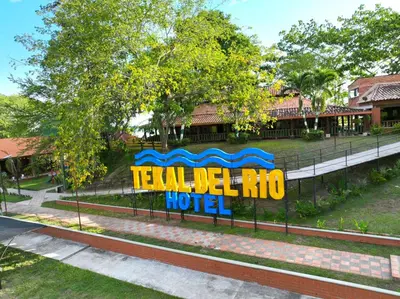 a sign for a hotel at a resort at Hotel Tekal del Rio in Puerto Boyacá
