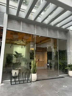 a large building with plants in front of it at Confortable Aparta Loft 903 Aiana Verde in Medellín