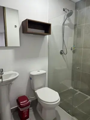 a bathroom with a shower and a toilet and a sink at Confortable Aparta Loft 903 Aiana Verde in Medellín