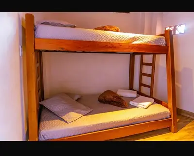 a couple of bunk beds in a room at Suite Doble Especial in Jericó