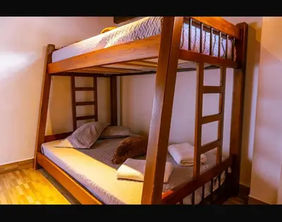 a couple of bunk beds in a room at Suite Doble Especial in Jericó