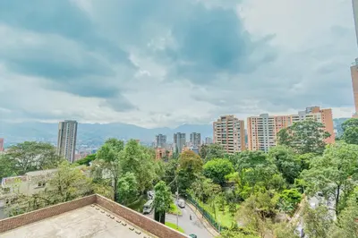 a view of a city with tall buildings and trees at NEW! Homey Loft El Tesoro-Fast Wifi in Medellín