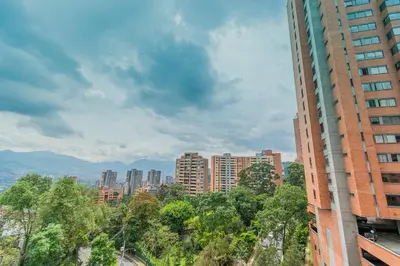 a view of a city with tall buildings and trees at NEW! Homey Loft El Tesoro-Fast Wifi in Medellín