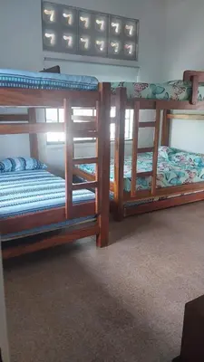 two bunk beds are in a room withthritisthritisthritisthritisthritisthritisthritisthritis at Finca Villa Maria in La Pintada