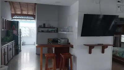 a living room with a flat screen tv on a wall at Finca Villa Maria in La Pintada