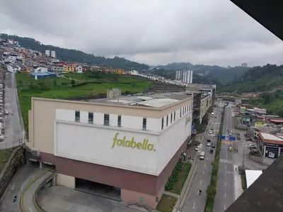 a building with a frito lay sign on the side of it at Apartamento Manizales II in Manizales
