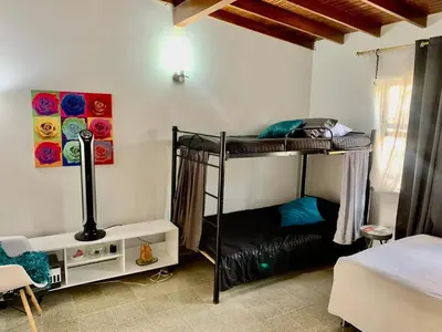 a bedroom with two bunk beds in a room at Accommodation HOUSETEL COCOON Medellin in Medellín