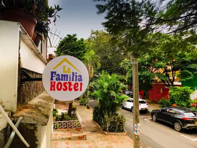 a sign for a familia hospital on the side of a street at La Familia Hostel - Manila in Medellín