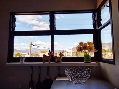 a window with a window sill with a view at Mayorca Homestay in Medellín