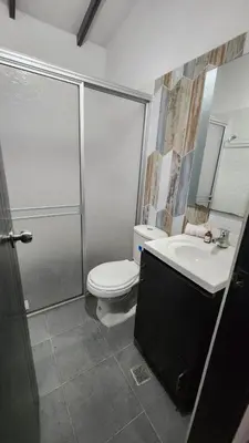 a bathroom with a shower and a toilet and a sink at moderno y nuevo aparta estudio en Laureles in Medellín