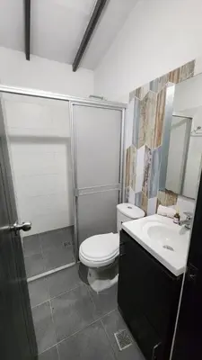 a bathroom with a toilet and a sink at moderno y nuevo aparta estudio en Laureles in Medellín
