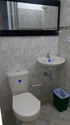 a bathroom with a toilet and a sink at usoinmobiliario in Medellín