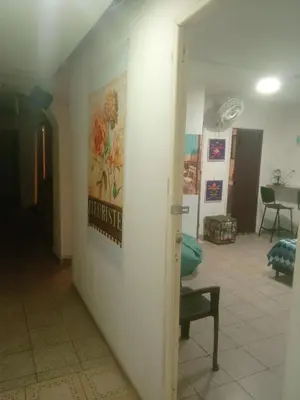 a room with a wall with a poster on it at usoinmobiliario in Medellín