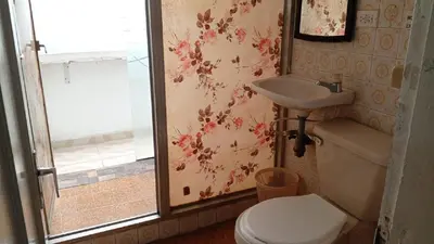 a bathroom with a toilet and a sink at usoinmobiliario in Medellín