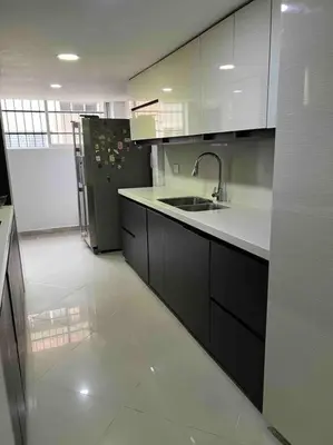 a kitchen with a sink and a refrigerator at Apto 4 habitaciones privadas 140mtros in Medellín