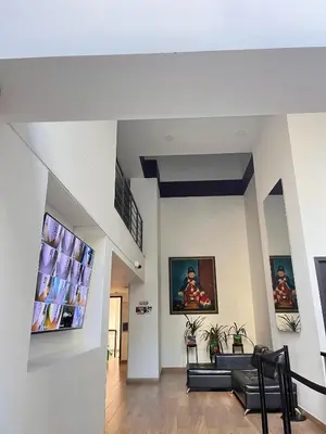 a living room with a couch and a tv at El Poblado acomodación familiar hasta 6 personas in Medellín