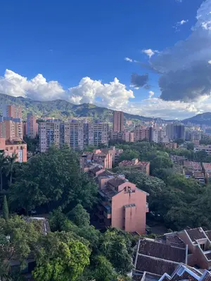 a view of a city with buildings and trees at El Poblado acomodación familiar hasta 6 personas in Medellín