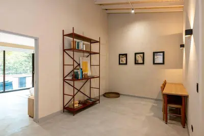 a room with a book shelf and a desk at Casa Penta Top Notch Villa in Medellín