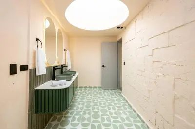 a bathroom with two sinks and two toilets at Casa Penta Top Notch Villa in Medellín