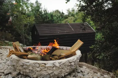 a fire pit sitting on a pile of rocks at Tiny House La Silleta in Medellín
