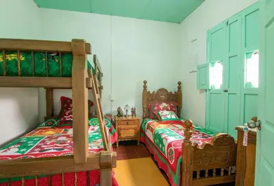 a bedroom with two beds and a bunk bed at CASA DUQUE JARDIN in Jardin