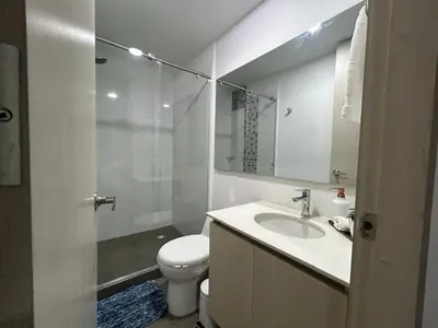 a bathroom with a sink and a toilet and a shower at Apartamento frente a Mallplaza in Manizales