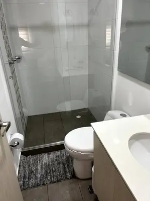 a bathroom with a shower and a toilet and a sink at Apartamento frente a Mallplaza in Manizales