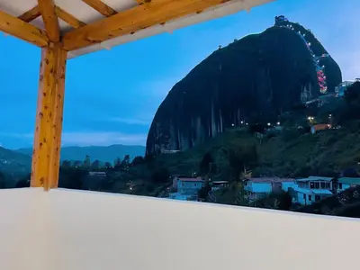 a view from a room with a view of a mountain at Cómoda casa con espectacular vista a la piedra y embalse in Guatapé