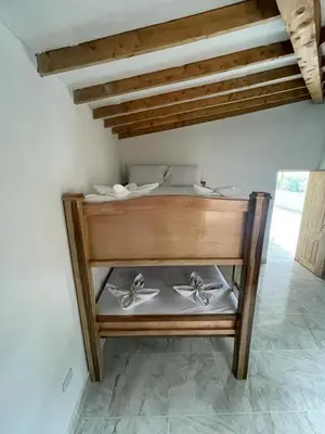a wooden shelf with three pairs of scissors on it at Cómoda casa con espectacular vista a la piedra y embalse in Guatapé