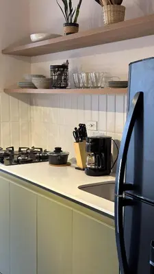 a kitchen with a stove and a counter top at Seijakumanila in Medellín