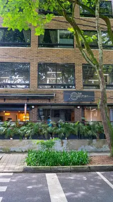 a building with a lot of plants in front of it at Apartamentos en el Poblado Medellín - Be Together by Roots Rentals TOG APTOS in Medellín
