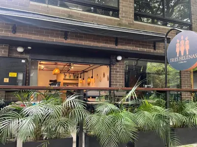 a restaurant with plants in front of a building at Apartamentos en el Poblado Medellín - Be Together by Roots Rentals TOG APTOS in Medellín