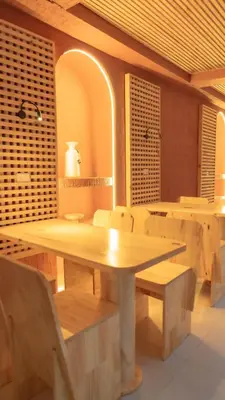a dining room with a wooden table and chairs at Leviu by Bernalo Hotels in Medellín