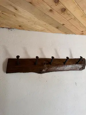 a wooden stick hanging on a wall with a ceiling at Hotel Campestre - CIUDADELA EL ARTESANO in Carolina del Principe