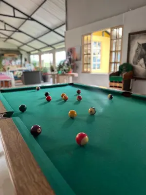 a pool table with balls on top of it at El Refugio del Colibrí in Santa Rosa de Cabal