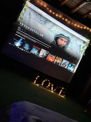 a sign for an event with a movie on it at El Refugio del Colibrí in Santa Rosa de Cabal