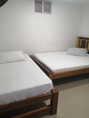 two beds sitting next to each other in a room at The Best Corner in San Rafael