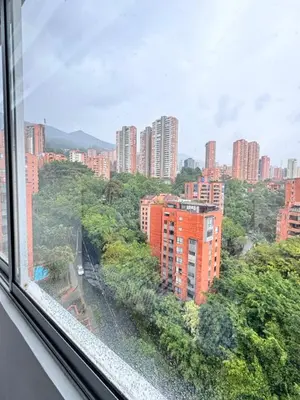 a view from a window of a city with tall buildings at 1705 Beautiful apartament, total view of the city in Medellín