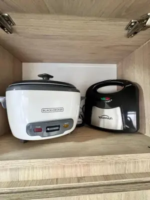 two toasters and a toaster sitting on a shelf at 1705 Beautiful apartament, total view of the city in Medellín